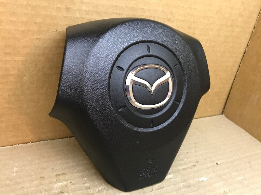 2004 2009 MAZDA 3 LEFT DRIVER SIDE STEERING WHEEL AIRBAG AIR BAG BLACK OEM 1